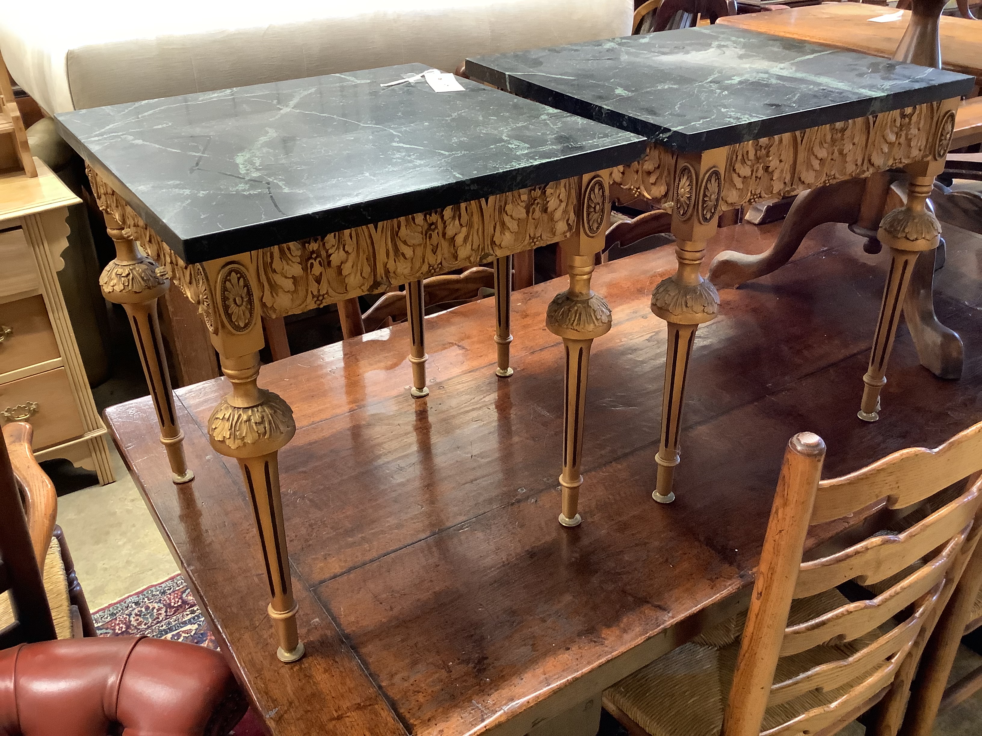 A pair of square giltwood side tables with variegated black marble tops, width 45cm, height 49cm